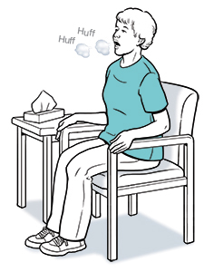 Woman sitting in chair huffing air out of lungs.