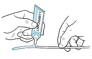 Closeup of hands applying lubricant to urinary catheter.